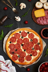 Traditional pizza pepperoni, assorted sausage, olives, arugula, corn, mozzarella