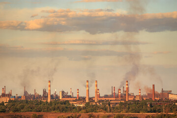 Panorama of a metallurgical plant that smokes