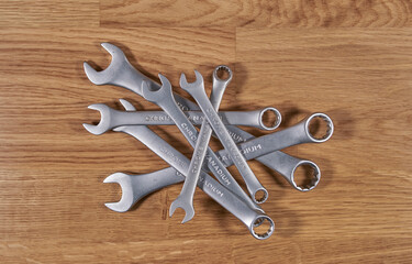 A set of metric spanners on a wooden table.