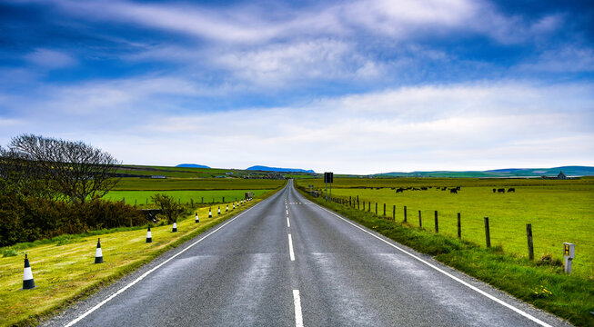 Straight Road Through Rural Landscape, Orkney Islands, Scotland, UK