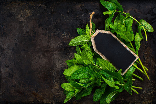 Fresh Mint Leaves With A Blank Chalkboard Label