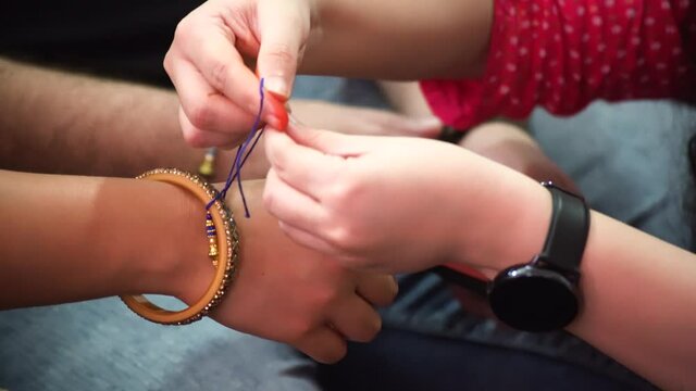 Sister tying Rakhi on the hand of her brother on the hindu festival of Rakhi. Symbolizes the relation and the vow of the brother to protect the sister