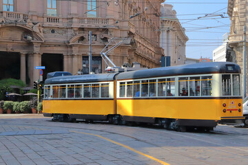 Tram giallo in piazza cordusio a milano italia, yellow street car in cordusio square in milan city in italy 