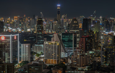 Fototapeta na wymiar Bangkok, thailand - Aug 28, 2020 : Bangkok downtown cityscape with skyscrapers at night give the city a modern style. Selective focus.