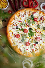 Traditional pizza pepperoni, assorted sausage, olives, arugula, corn, mozzarella