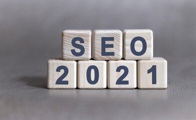 SEO text on wooden cubes on a monochrome background