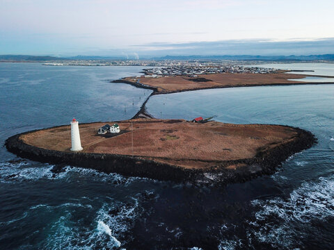 Aerial view of the lighthouse on the island of Gr&radic;&ge;tta connected by rocks to the Seltjarnarnes Peninsula, Reykjavik, Iceland.
