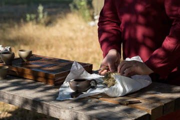 Chinese tea ceremony. Ceramic teapot made of clay and bowls on a wooden background.