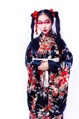 young pretty geisha in black kimono with sakura, asian ethno closeup on white background isolated