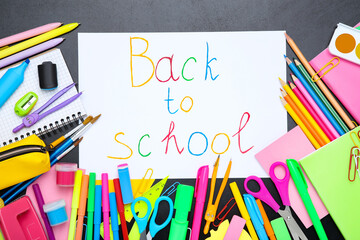 Different school supplies with text Back to School on black background