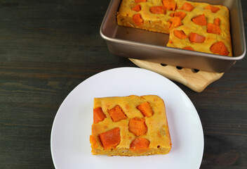 Slice of Fresh Baked Butternut Squash Cake Bar on White Plate for the Concept of Cooking_At_Home