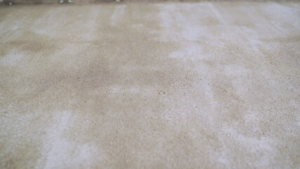 Concrete primed floor. The floor is painted, white cement.