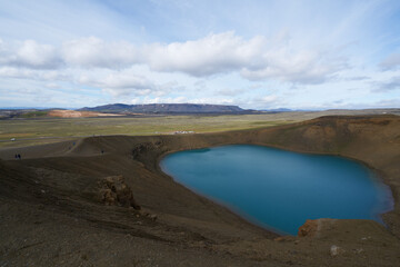 Fototapeta na wymiar Emerald blue colored water of circular lake in Crater Víti (hell) at Krafla volcanic area, Mývatn region, Northeastern Iceland, Scandinavia