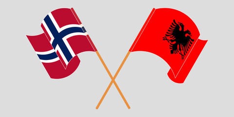 Crossed and waving flags of Albania and Norway