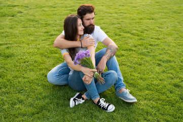 Carefree couple in love cuddling relax in park, youth day concept