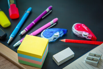  Colorful school accessories on a chalkboard