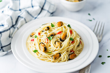 Mussel pasta with pepper and parsley in a plate
