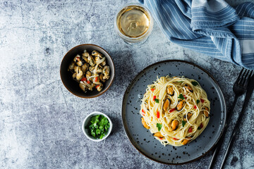 Mussel pasta with pepper and parsley in a plate