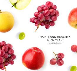 Creative happy and healthy new year card made of grapes and apples on the white background. Grapes and apples happy new year, top view, festive greeting card.	