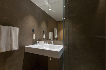 Interior of a hotel bathroom interior with shower cabin