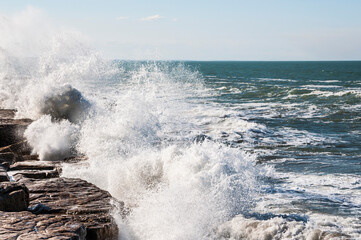 waves crashing on rocks