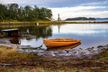 Fototapeta na wymiar landscape of the island against the background of old wooden boats lying on the shore