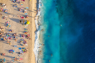 Mediterranean sea. Aerial view on the beach and people. Vacation and adventure. Beach and blue water. Top view from drone at beach and azure sea. Travel and relax - image