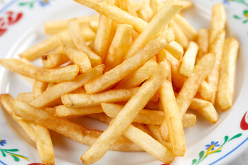 golden french fries on the wooden background