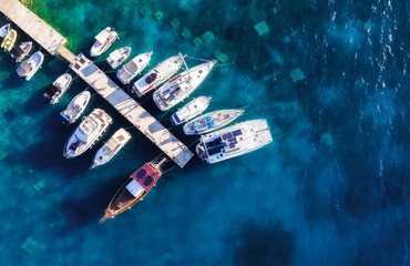 Mediterranean sea. View on the marina from drone. Aerial view of floating boat on blue sea at sunny day. Travel and relax - image