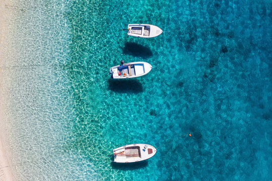Mediterranean sea. Seascape with boats. Aerial view of floating boat on blue sea at sunny day. Top view from drone at beach and azure sea. Travel and relax - image