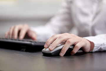 Female hands or woman office worker typing on the keyboard