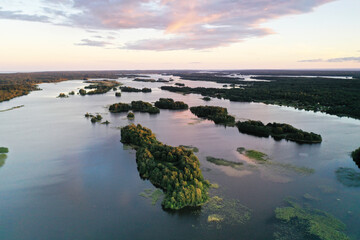 panoramic view of the island with old wooden buildings on the lake filmed from a drone
