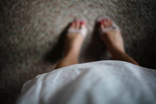White eyelet dress and sandals view from above looking down