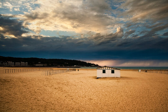 Hendaye beach with cabin and dramatic sky