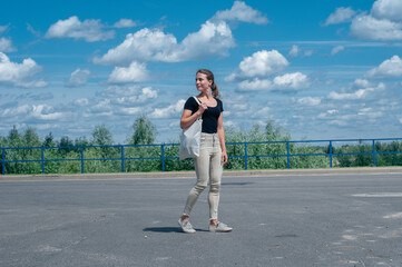 Woman walking with suitcase on shoulder