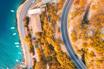 Aerial view of road, boats and yachts in water, buildings at sunset in autumn. Colorful landscape...