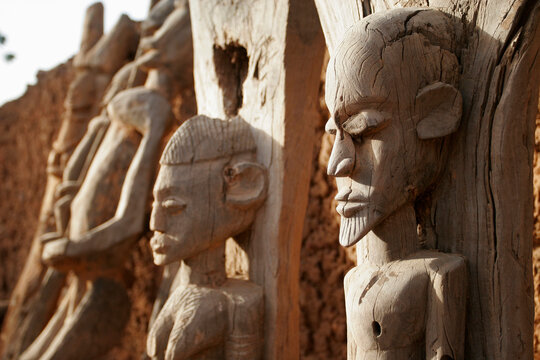 Faces of Dogon wood sculptures in Teli village, Dogon country, M