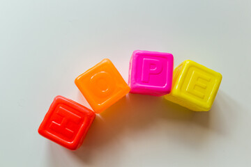 Hope word made of children plastic cubes