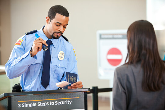 Airport: Using Flashlight to Examine Passport