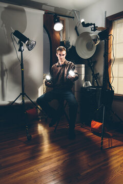 photographer in studio with gear
