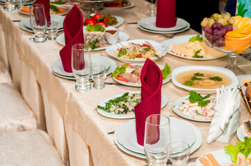 Laid banquet table with food