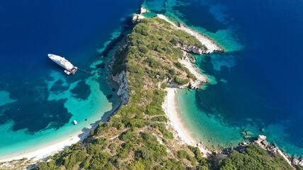 Aerial photo taken by drone of Caribbean tropical exotic steep cliff island bay with turquoise...
