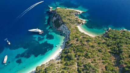 Aerial photo taken by drone of Caribbean tropical exotic steep cliff island bay with turquoise clear sea sandy beaches and rare limestone trees