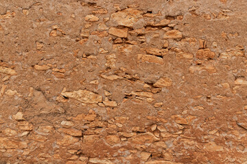 an antique brown wall made of stones