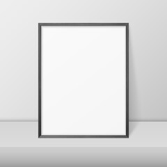 Obraz premium Vector 3d Realistic A4 Black Wooden Simple Modern Frame on a White Shelf or Table Against a White Wall. It can be used for presentations. Design Template for Mockup, Front View