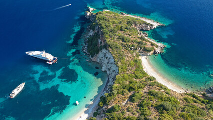 Aerial photo taken by drone of Caribbean tropical exotic steep cliff island bay with turquoise...