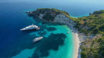 Aerial drone photo of beautiful paradise steep cliff sandy beach of Gidaki accessible by short hiking in beautiful Ionian island of Ithaki or Ithaca, Greece