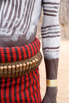 Karo Tribesman wearing a belt of bullets, Lower Omo Valley, Ethiopia, Africa