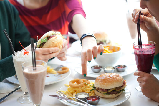People eating fast food served in a restaurant.