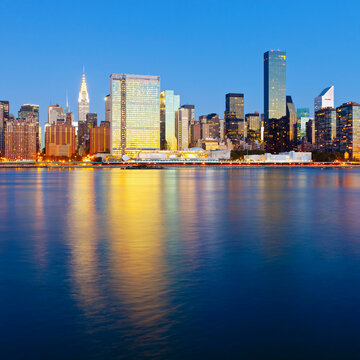 Skyline of Midtown Manhattan seen from the East River showing the Chrysler Building and the United Nations building, New York, United States of America